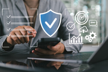 Business professional managing cybersecurity data and analytics through a virtual dashboard interface.