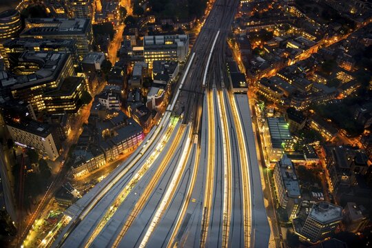 View of London Bridge station, train tracks and illuminated platforms, night shot, London, England, United Kingdom
