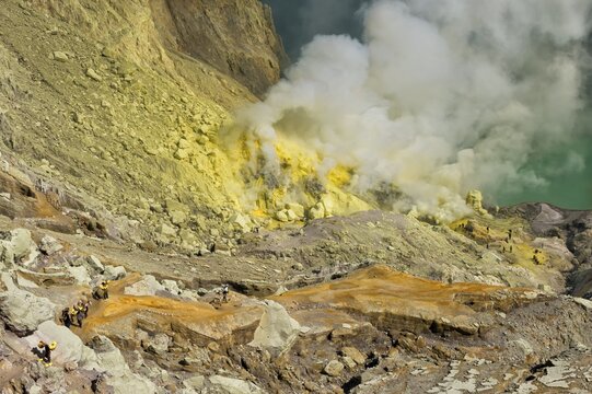 Sulphur carriers climbing out of Kawah Ijen volcano, Ijen crater, Banyuwangi, East Java, Indonesia