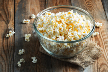 Popcorn on wood color background.Food and snack concepts ideas.Minimal style top view mockup