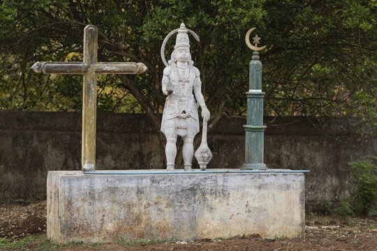 Symbols for three religions, Christian cross, Hindu monkey god Hanuman, Islamic crescent, Andhra Pradesh, India
