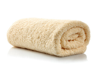 Soft fluffy cream colored towel rolled neatly on white background