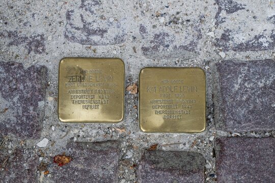 Two Stumbling Stones embedded in the pavement as memorials against forgetting the injustice of National Socialism, Copenhagen, Denmark
