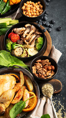 Table scene of various delicious foods. Healthy, family dinner.