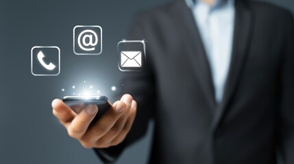 Contact Us Background, Modern Communication Concept, Businessman in Formal Suit Holding Smartphone with Floating Glowing Contact Icons Including Email Envelope, Phone with Copy Space