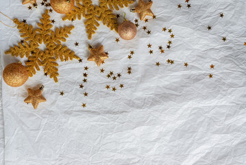 christmas decorations on paper texture background, gold snowflake, Christmas ball, gold glitter.