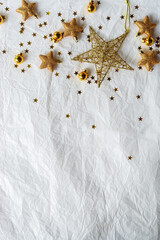 Gold Christmas theme decoration on paper texture background, gold star, star glitter, Christmas bell.