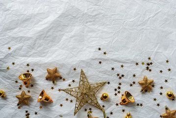 Gold Christmas theme decoration on paper texture background, gold star, star glitter, Christmas bell.