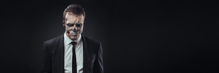 Fototapeta premium Skeleton Face Man in Suit Wide Banner with Copy Space