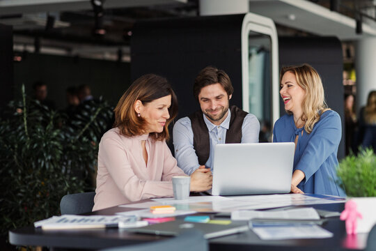 Business colleagues sharing screen during video call.