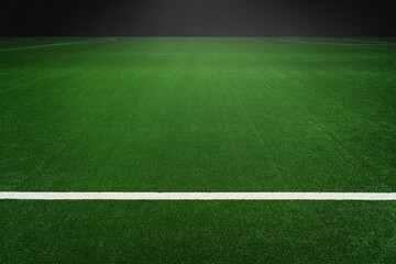 Obraz premium textured soccer game field with isolated, free copy space background - stadium center, midfield