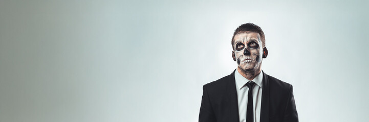 Halloween Face Painted Businessman Wide Banner with Copy Space