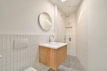 Modern minimalist bathroom with wooden vanity