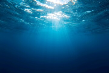Obraz premium Calm Underwater Ocean Scene with Sunlight Beams and Clear Blue Water.