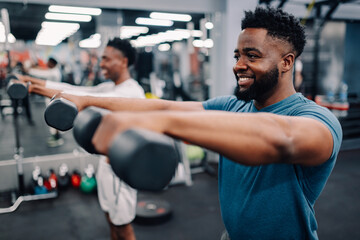 Two men lifting weights during workout session at gym