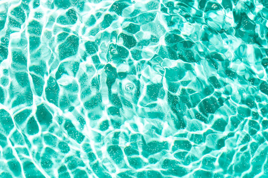 Rippling water surface with sunlight reflections