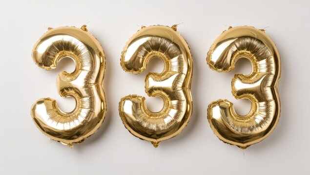 Gold balloons in the shape of the number 333