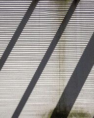 geometric pattern of light and shadow on the wall