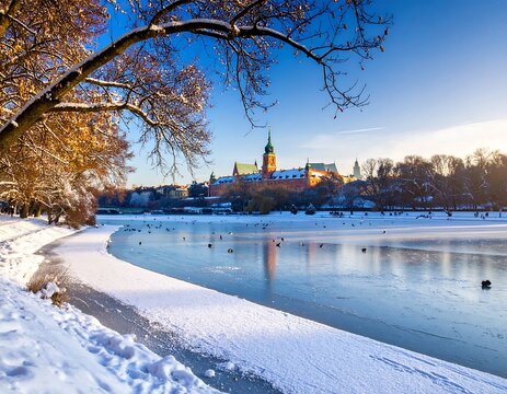 Fototapeta Winter panorama of Warsaw Old Town reflected on the frozen lake surface
