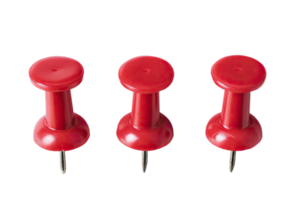Three red pushpins on a black background