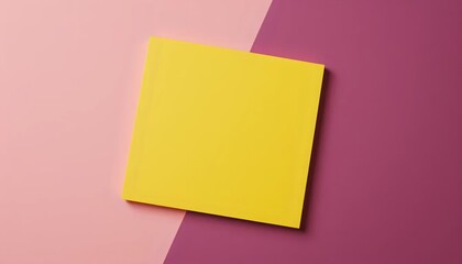 A yellow piece of paper on a pink and purple background.