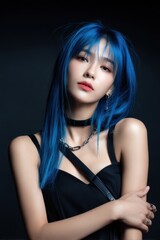 Fototapeta premium A woman with long blue hair and a black dress is posing for a photo