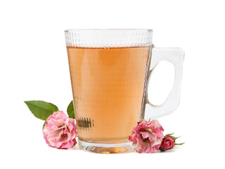 Tasty rose tea in glass cup and flowers isolated on white