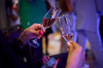 A Celebration Toast featuring beautifully crafted Champagne Glasses filled with bubbly drink