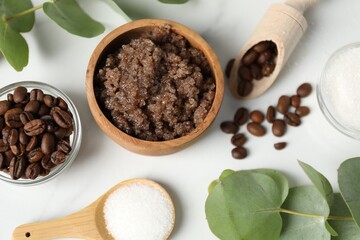 Natural body scrub and ingredients on white table, flat lay