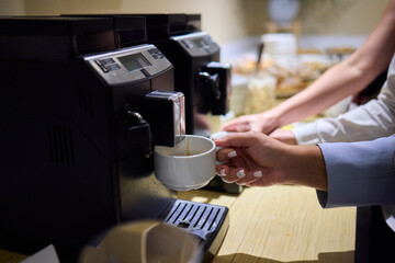 Coffee Station featuring Modern Espresso Machines and Enthusiastic Pouring Action for Everyone