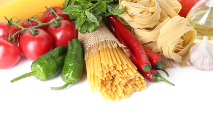 Different types of pasta and ingredients isolated on white