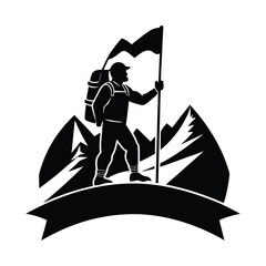 Fototapeta premium Silhouette of a climber planting a flag on a mountain peak