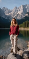 Naklejka premium Caucasian female adult enjoying serene mountain lake views in casual outfit
