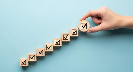 Hand Completes Checkbox Tower Representing Success and Achievement