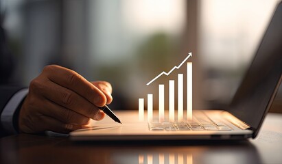 Businessperson using laptop to track growth