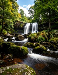 Waterfall cascading through mossy rocks (1)