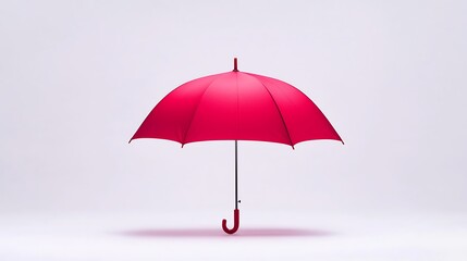 A vibrant red umbrella stands alone against a minimalistic background, symbolizing protection and style.