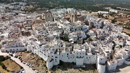Scenic Aerial Footage of Ostuni, the White Hilltop Town in Southern Italy Surrounded by Historic Architecture