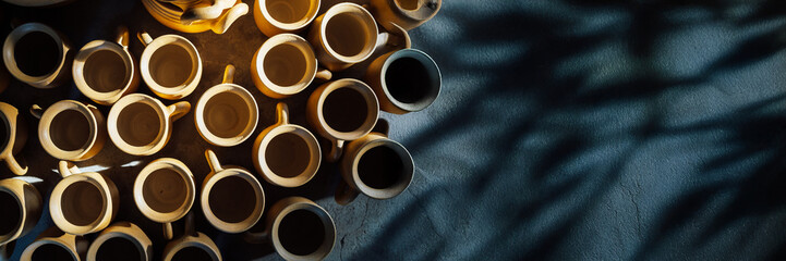 Clay Mugs Arrangement in Sunlight, Wide Banner
