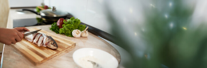 Fish Preparation on Wooden Board Wide Banner with Copy Space