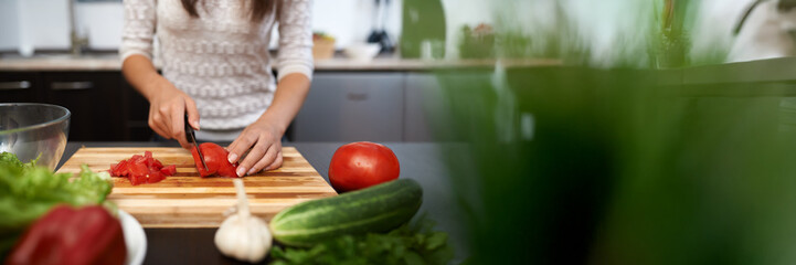 Woman Preparing Salad in Kitchen Wide Banner