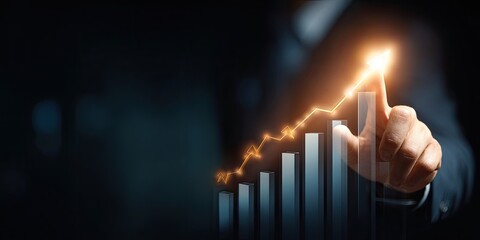 Business hand pointing to a rising graph