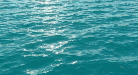Teal Ocean Water Texture: Sparkling Sunlight on Gentle Waves