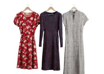 Three midi dresses on hangers.  Red, navy, and light gray,  with floral, polka dot, and small dot patterns.  Short, 3/4, and long sleeves.  Classic, simple silhouette