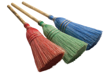 Three colored brooms with wooden handles
