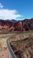 Winding road through red rock canyon