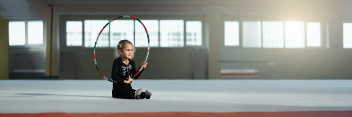 Little Girl with Hula Hoop in Gym, Wide Banner © Аrtranq