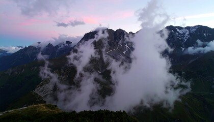 A majestic mountain range shrouded in a vast cloud formation during a serene twilight.