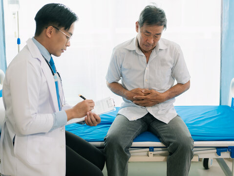 An elderly Asian man with stomach pain visited a doctor due to food poisoning