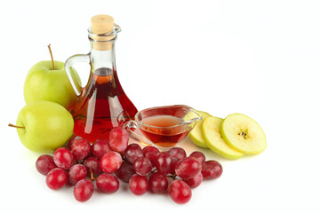 Apple cider and vinegar in a vintage bottle isolated on a white background.